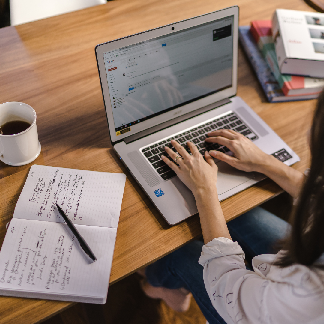 Blogger working on a laptop with notes and coffee – building an online business from anywhere. Blogger working on a laptop with notes and coffee – building an online business from anywhere.